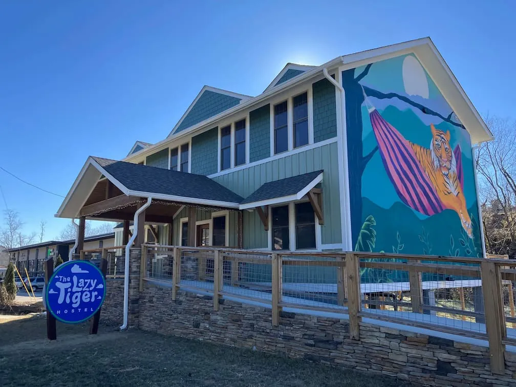The Lazy Tiger Hostel exterior with sign